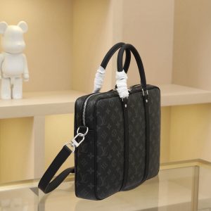 Alternative view of All-Steel Hardware The rugged Damier Graphite canvas lends this Porte-Documents Voyage Small Briefcase a distinctive character. Smooth leather trim and a spacious interior create the perfect blend of luxury and practicality. Dimensions: 35.0 x 27.0 x 6.0 cm